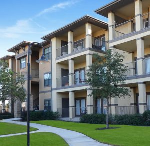 Apartments in San Antonio near Six Flags Fiesta Palomino Apartments, a sprawling apartment complex nestled amidst lush greenery and adorned with vibrant trees.