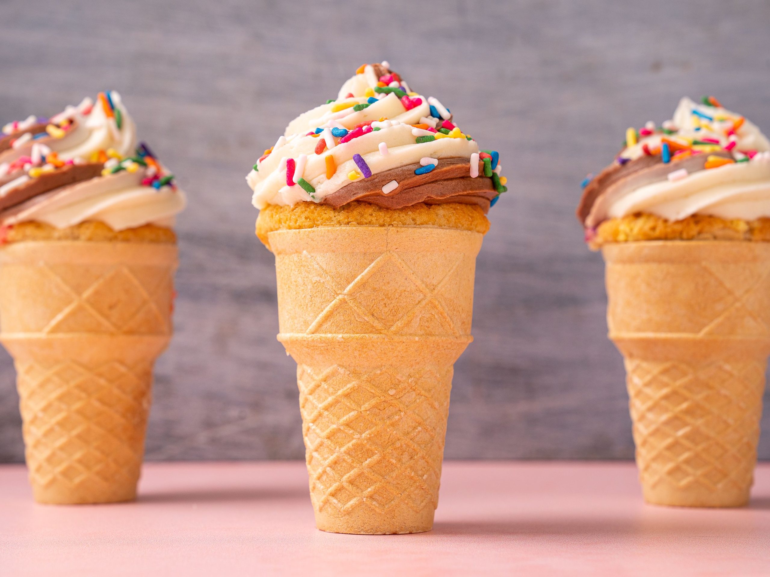 Apartments in San Antonio near Six Flags Fiesta In celebration of National Ice Cream Cone Day, indulge in three delicious ice cream cones topped with delightful frosting and sprinkles.